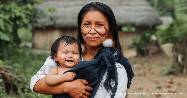 Indigenous women holding her baby