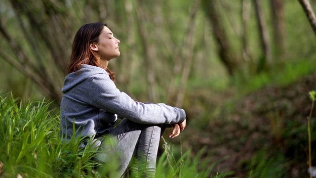 Woman sitting in nature