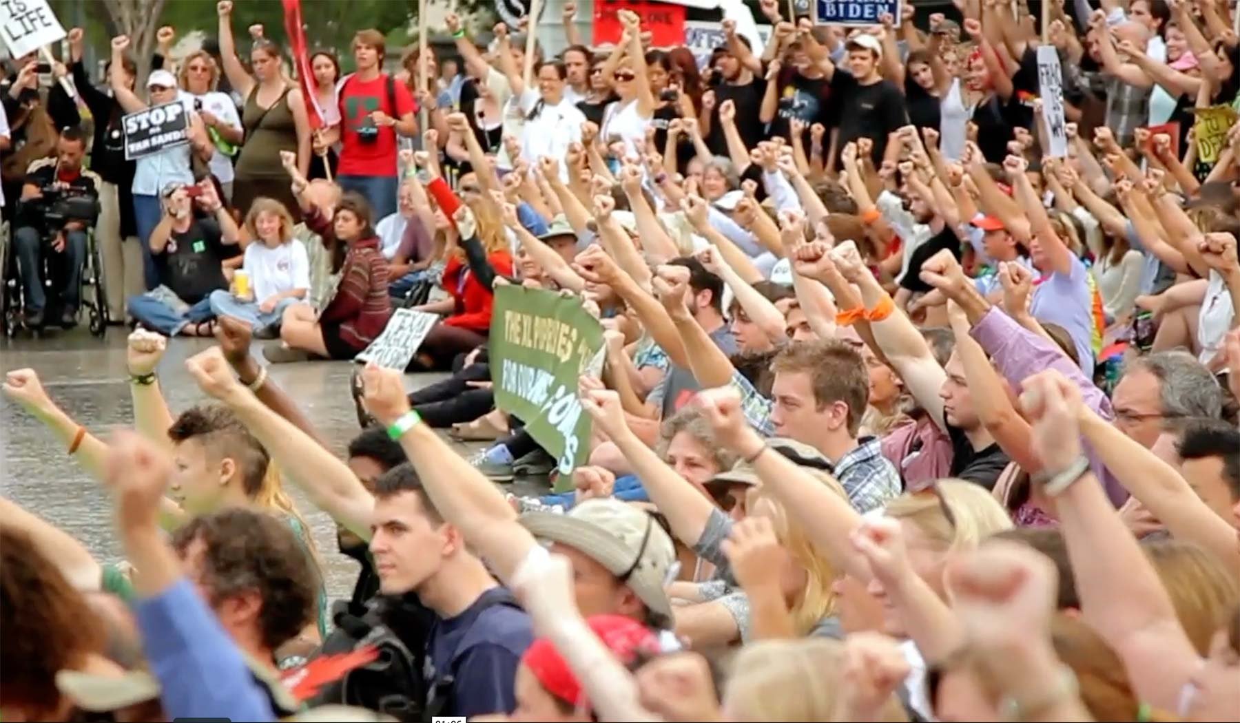 Crowd of people with their arms in the air