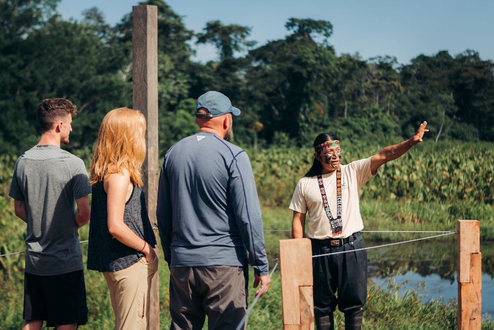 Achuar guide talking to tourists 