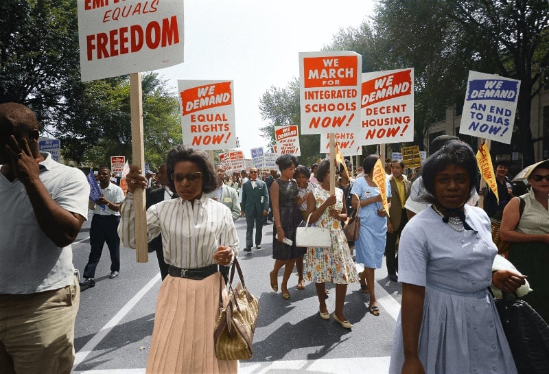 People protesting with signs during the March on Washington 